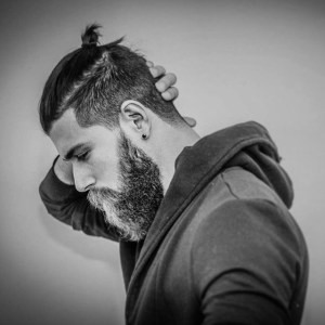 Here it doesn't even seem like a bad look but c'mon if you're gonna tie back those few hamster hairs why not just cut it off?